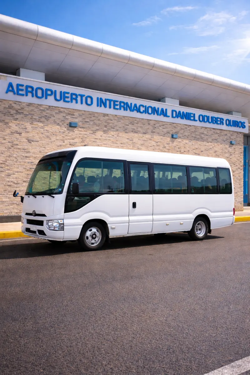 White air-conditioned shuttle minibus parked at Liberia airport (LIR) for shared transfers to Tamarindo